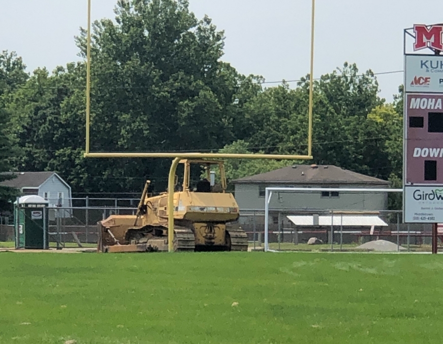 bulldozer on football field