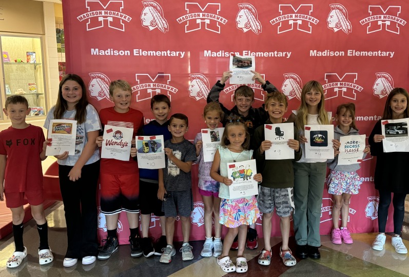 Group of students with prize certificates